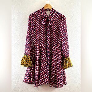 D’zzit dress in red, white and blue zig zags with yellow ruffle sleeve S